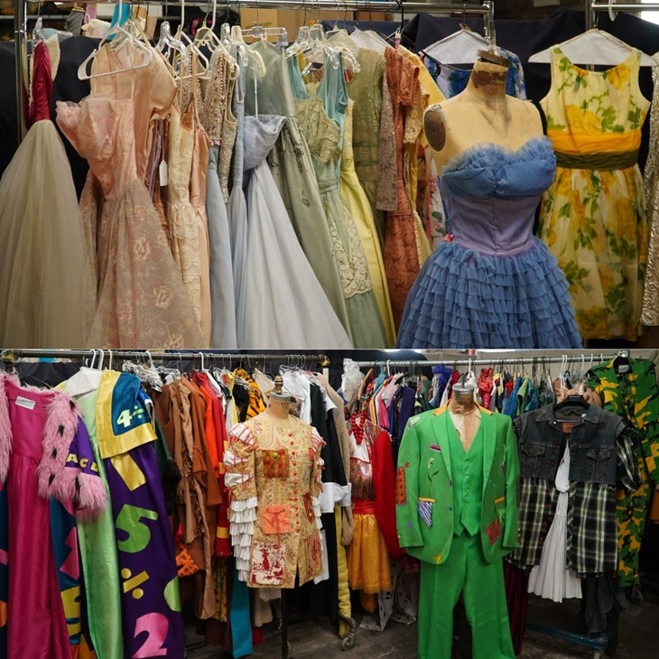Costumes on hanger rack in costume shop