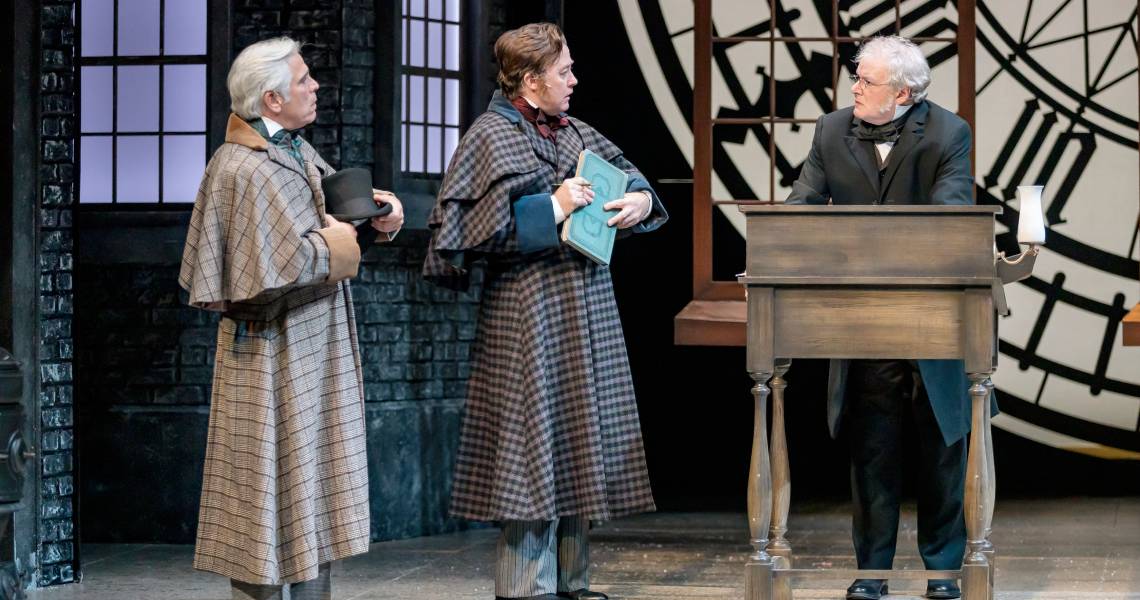 R. Ward Duffy (Solicitor), Justin McCombs (Solicitor) and Andrew May (Ebenezer Scrooge) in A CHRISTMAS CAROL at Cincinnati Playhouse in the Park. Photo by Mikki Schaffner.