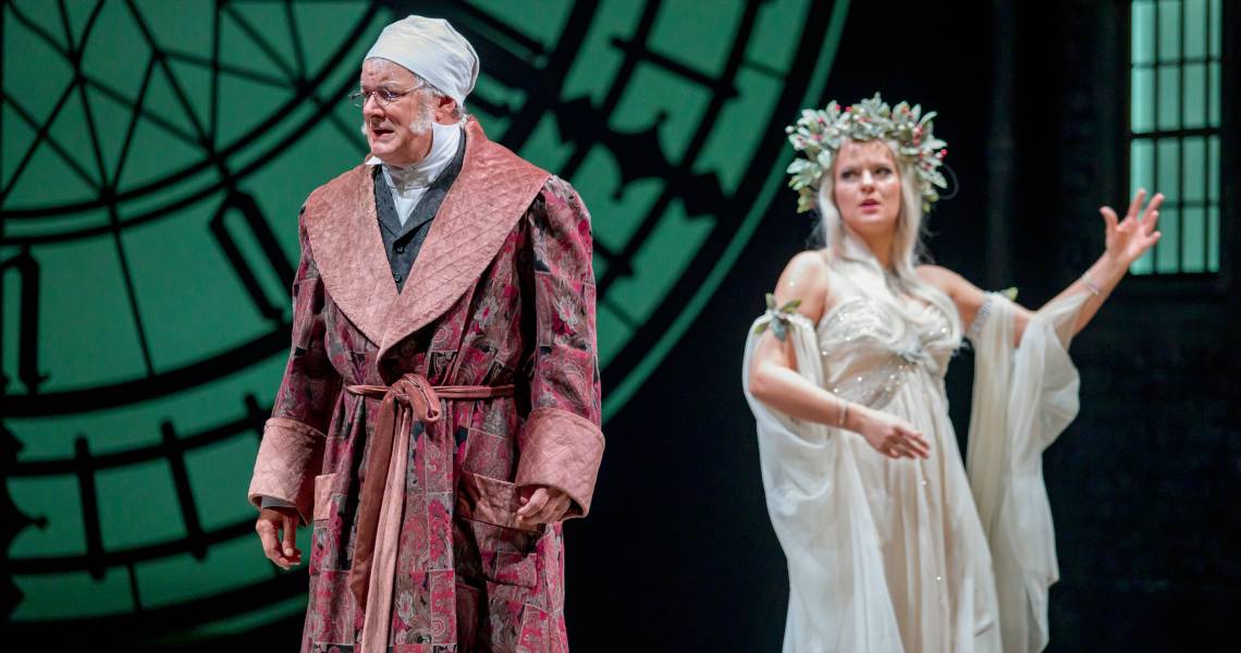 Andrew May (Ebenezer Scrooge) and Maggie Lou Rader (Ghost of Christmas Past) in A CHRISTMAS CAROL at Cincinnati Playhouse in the Park. Photo by Mikki Schaffner.