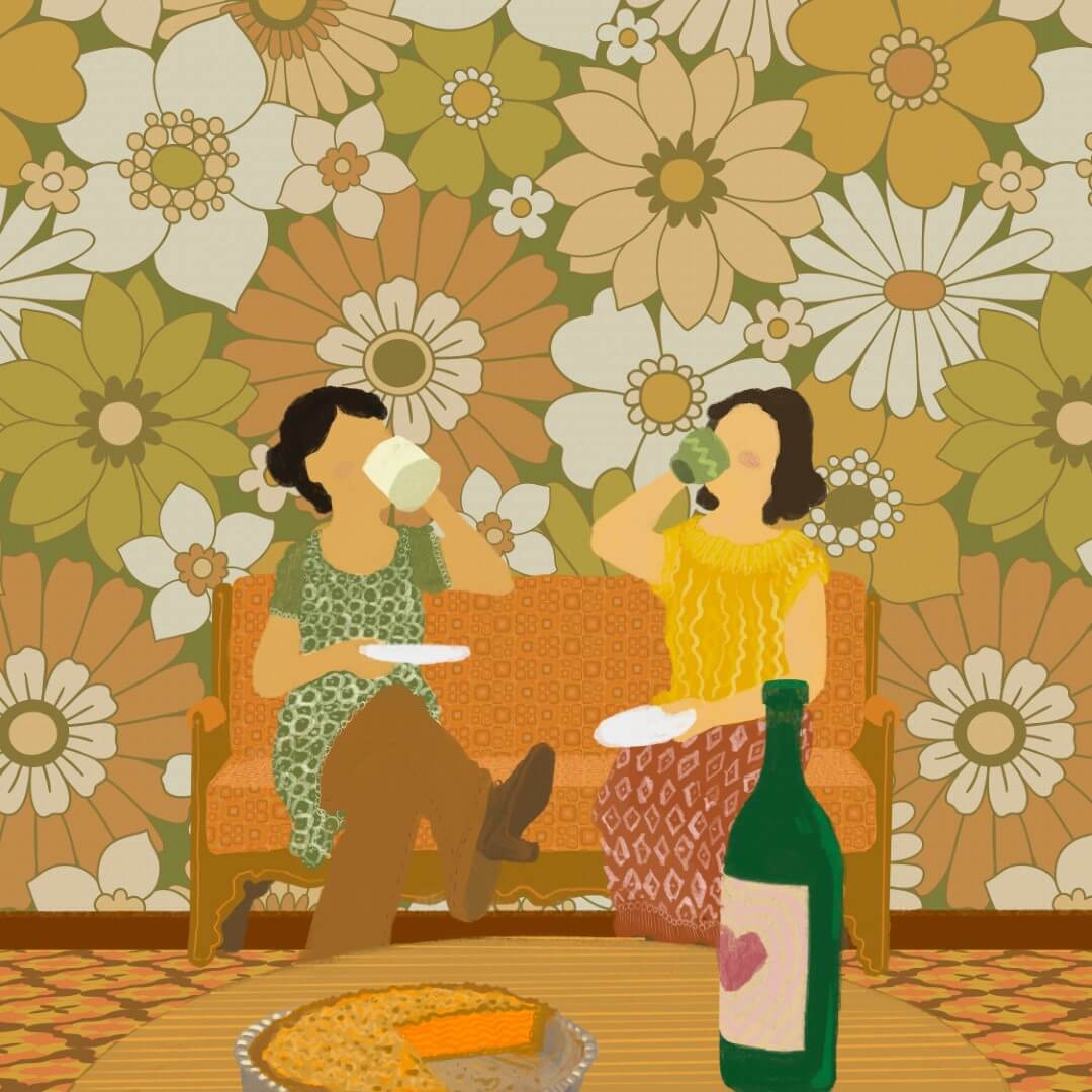 Two women enjoying wine and pie